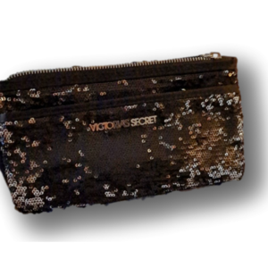 Victoria's Secret Clutch Handbag. Black Sequins Zip closures. Nameplate